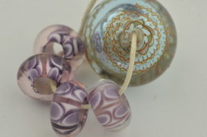 set of blown bead with amethyst and clear dot work beads
