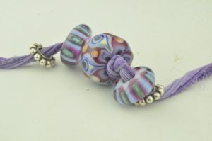 purple magenta periwinkle eye w/ side beads
