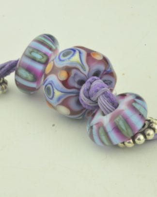 purple magenta periwinkle eye w/ side beads