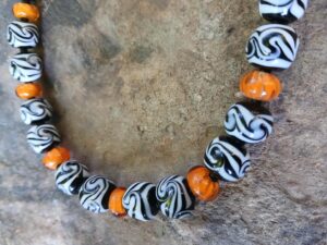 Beads made individually out of black and white glass, with special goldamber accent beads 